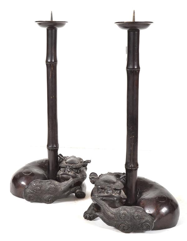 Appraisal: A PAIR OF TH CENTURY ORIENTAL BRONZE BAMBOO-SHAPED CANDLESTICKS supporting