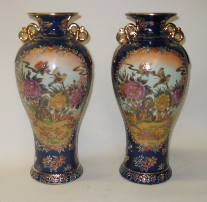 Appraisal: PAIR OF COBALT BLUE PORCELAIN VASES each having an elaborate