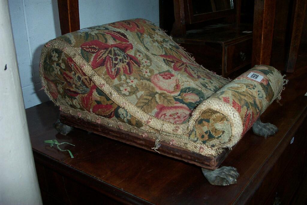 Appraisal: An early th century footstool of scrolled outline with brass