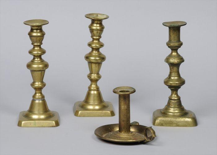 Appraisal: THREE BRASS CANDLESTICKS Together with a brass chamberstick each with