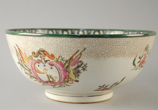 Appraisal: A Porcelain Armorial Bowl with a green and floral border