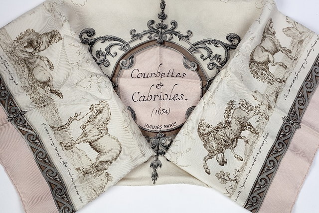 Appraisal: An Herm s 'Courbettes et Cabrioles' silk scarf in pale