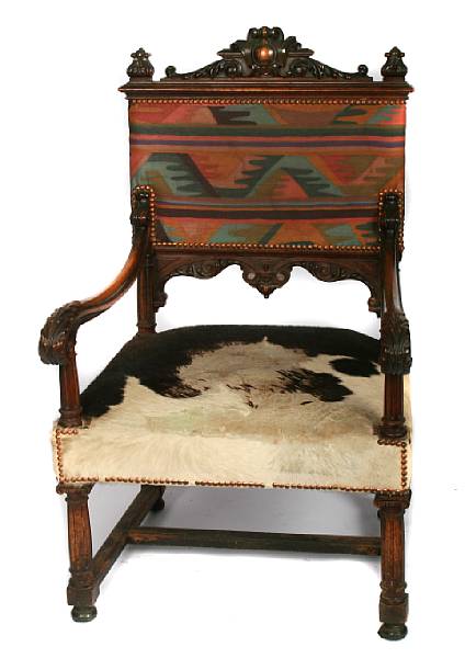 Appraisal: A Louis XIII style carved mahogany armchair height in width