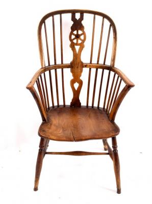 Appraisal: A fruitwood ash and elm Windsor armchair with a wheel