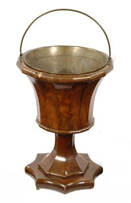 Appraisal: A Dutch mahogany brazier with a brass swing handle and