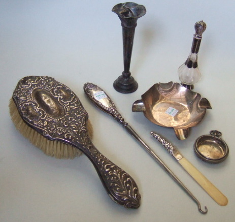 Appraisal: A silver ashtray Birmingham a silver mounted hairbrush a trumpet