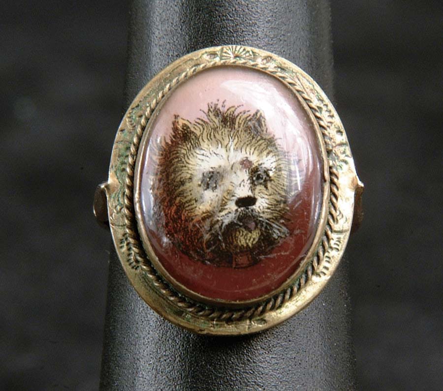 Appraisal: ANTIQUE REVERSE PAINTED DOG RING Outstanding k yellow gold Victorian