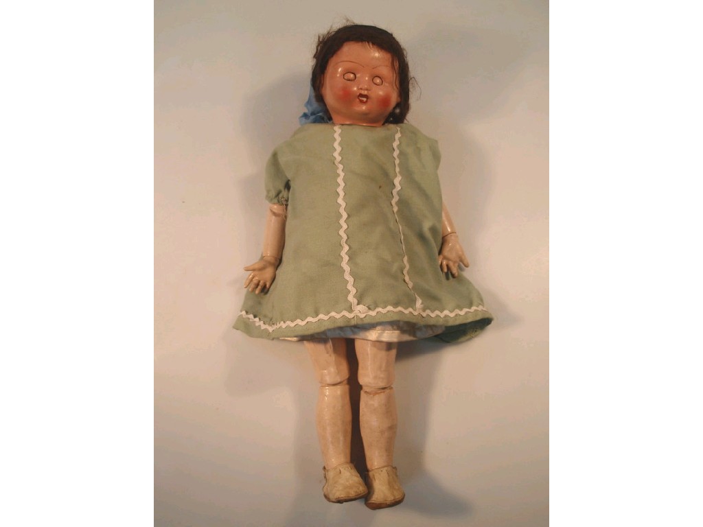 Appraisal: A rosy cheeked doll with sleeping blue eyes brown mohair