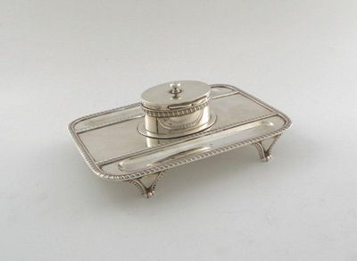 Appraisal: A Victorian silver inkstand rectangular form gadroon borders central oval