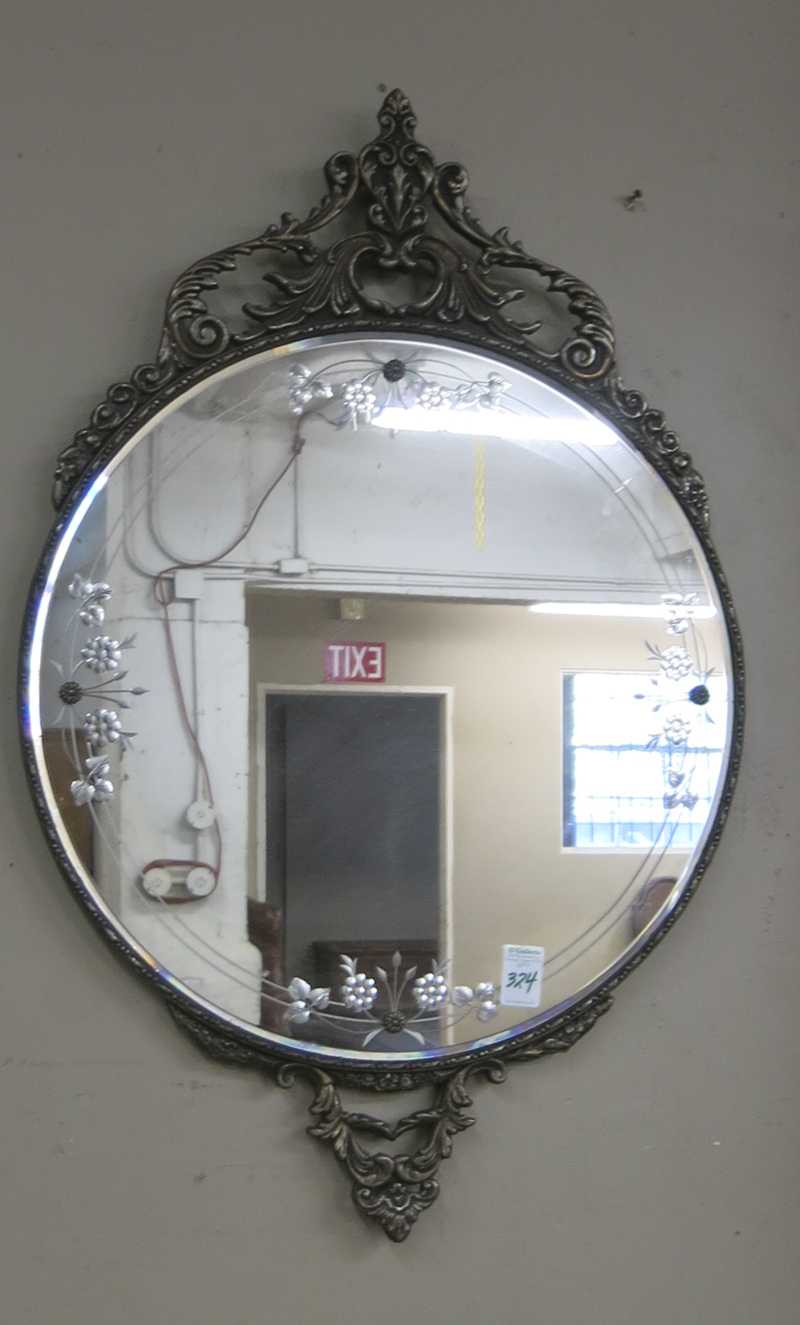 Appraisal: ROUND WALL MIRROR American c s with reverse floral-etched border