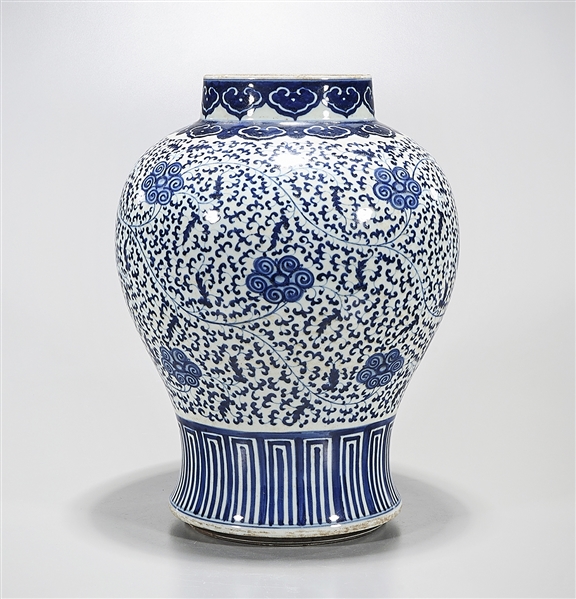 Appraisal: Chinese blue and white porcelain vase with scrolling floral design