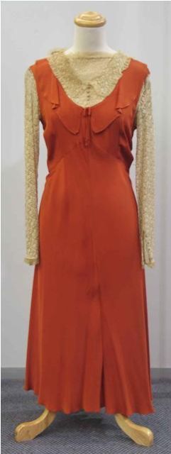 Appraisal: Afternoon dress in rust toned rayon with cream lace panel