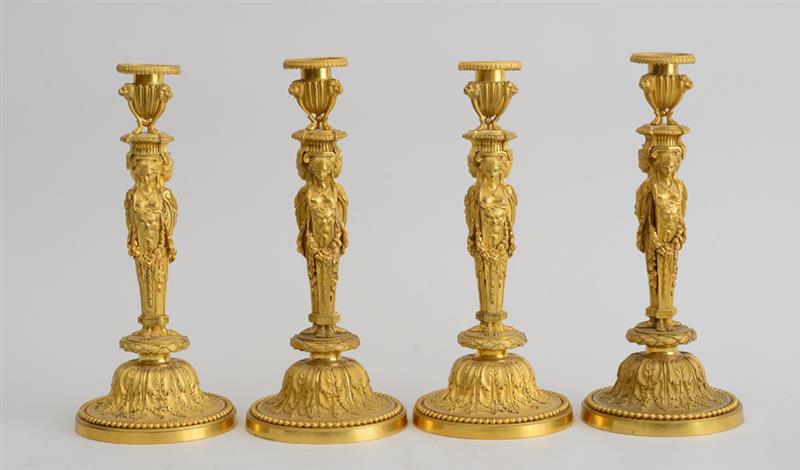 Appraisal: SET OF FOUR LOUIS XVI STYLE GILT-BRONZE CANDLESTICKS Each Ionic