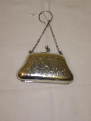 Appraisal: A COIN PURSE with chain and ring leaf chased back