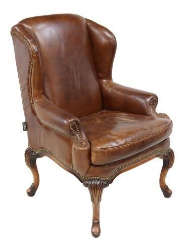 Appraisal: English Queen Anne style wingback armchair Artsome for Coach House