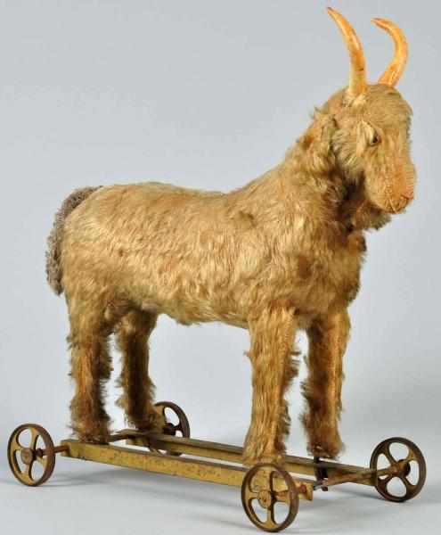 Appraisal: Large Mohair-Covered Goat Child's Pull Toy On metal base with