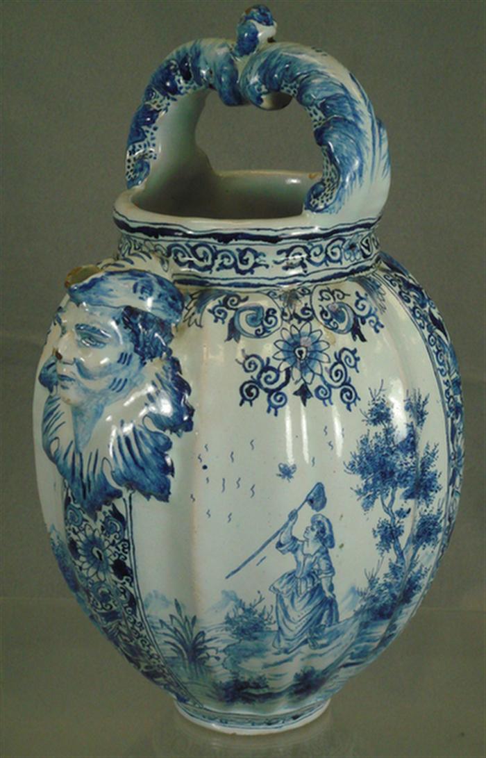 Appraisal: Delft handled jug th c blue and white scenes depicting