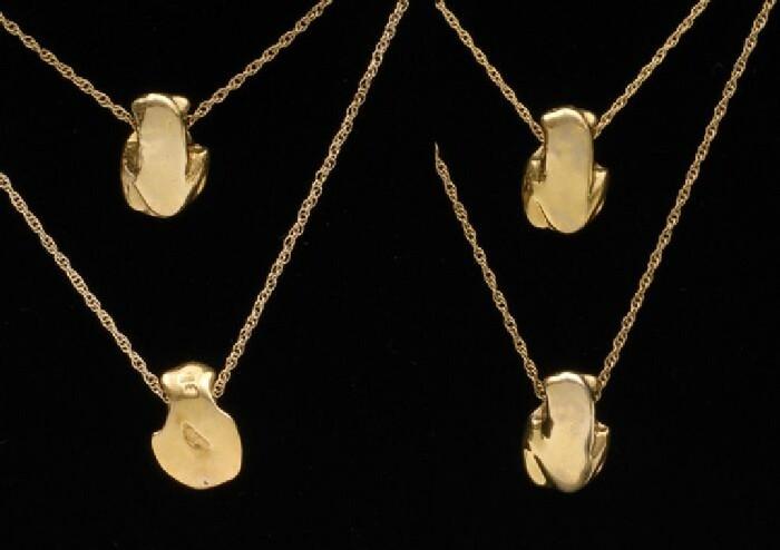 Appraisal: Four Frog Pendants on Chains All stamped k in