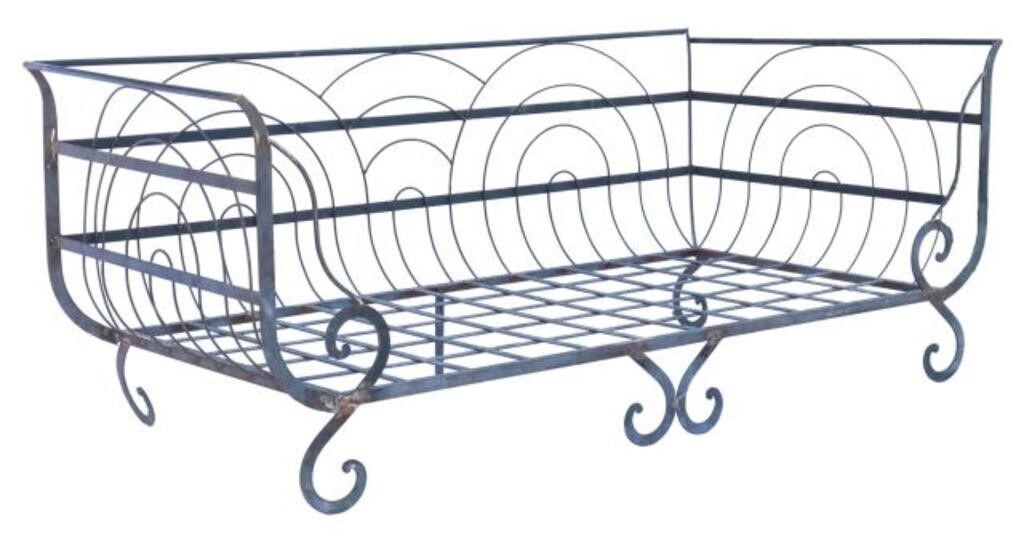 Appraisal: Large scrolled iron patio sofa daybed th c having rolled