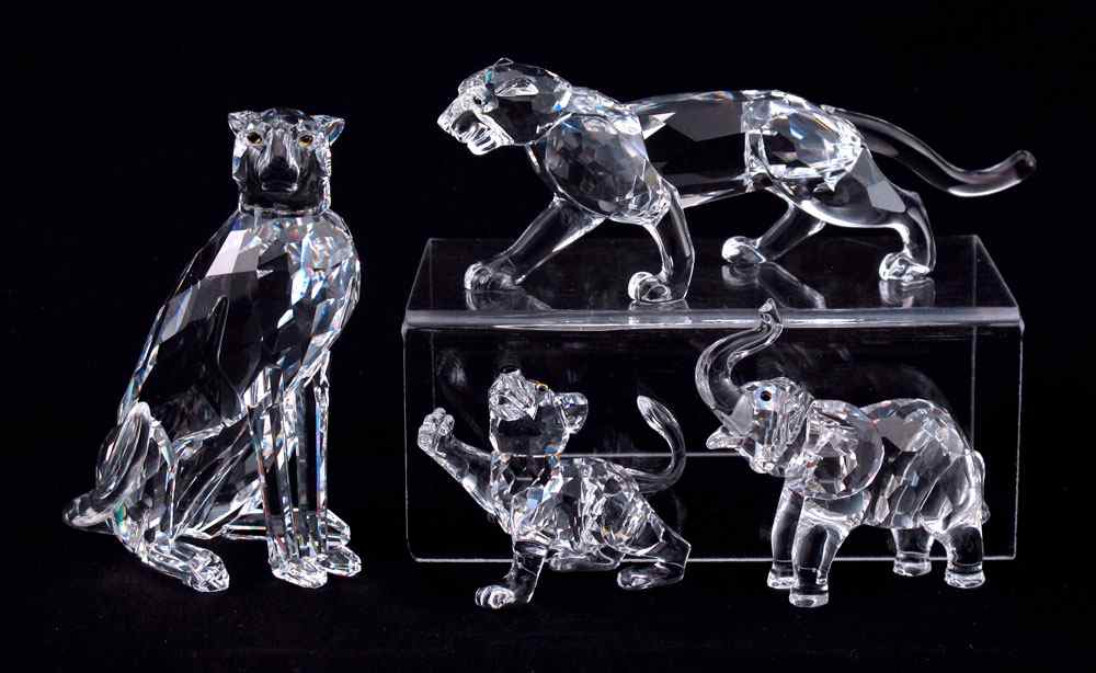 Appraisal: SWAROVSKI CRYSTAL FIGURINES AFRICAN WILDLIFE to include CHEETAH Var Michael