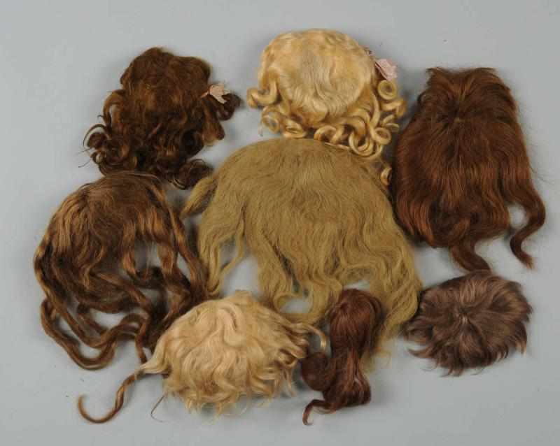 Appraisal: Lot of Doll Wigs Antique wigs one particularly lovely blonde