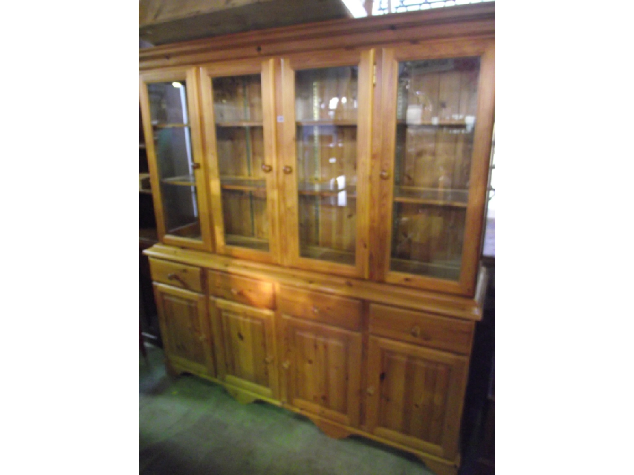 Appraisal: A contemporary pine kitchen dresser the lower section enclosed by