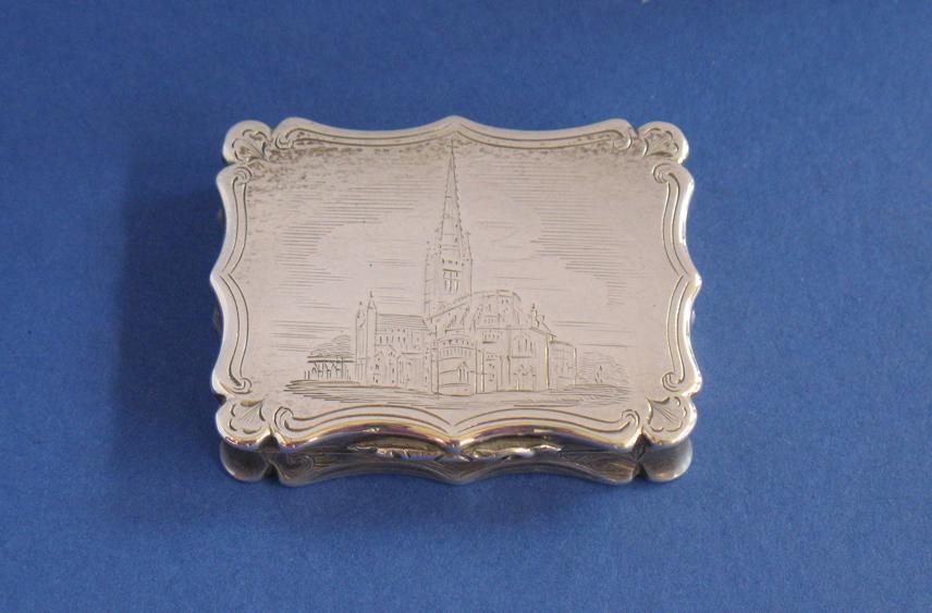 Appraisal: A VICTORIAN ENGRAVED CASTLE TOP VINAIGRETTE of shaped rectangular form