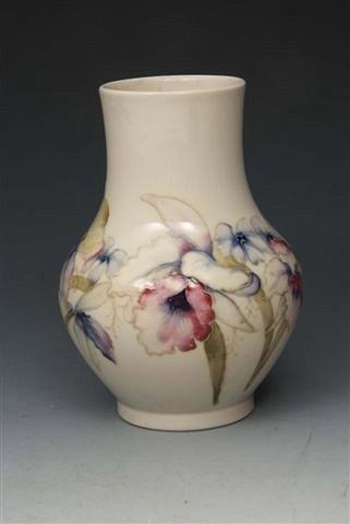 Appraisal: A MOORCROFT 'ORCHID' PATTERN VASE on a white ground circa