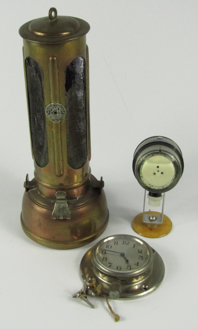 Appraisal: A Powell Hanmer brass lamp with oval gauge panels chrome