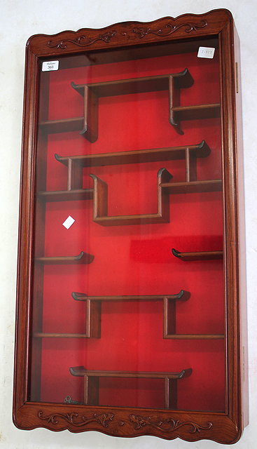 Appraisal: A CHINESE HARDWOOD WALL HANGING DISPLAY CABINET with a variety