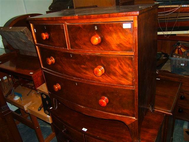 Appraisal: A Victorian bow fronted mahogany chest of two short and