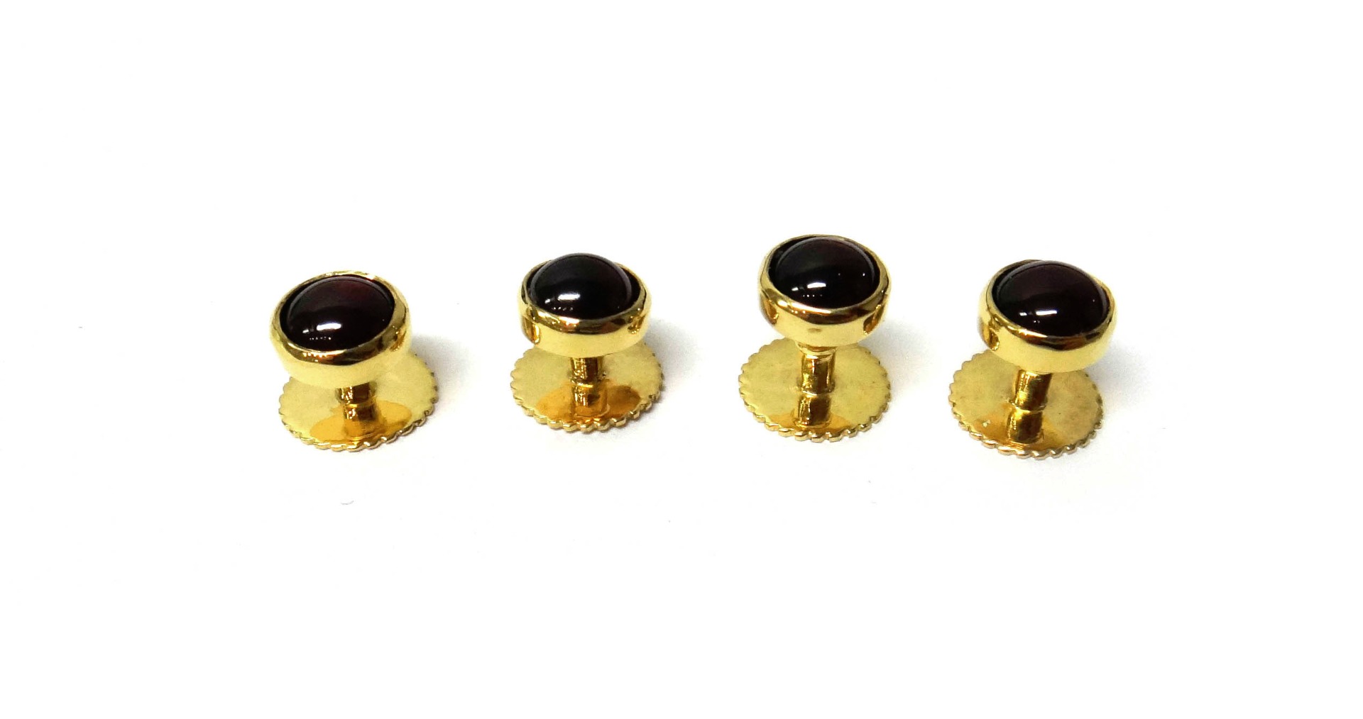 Appraisal: A set of four ct gold and carbuncle garnet set