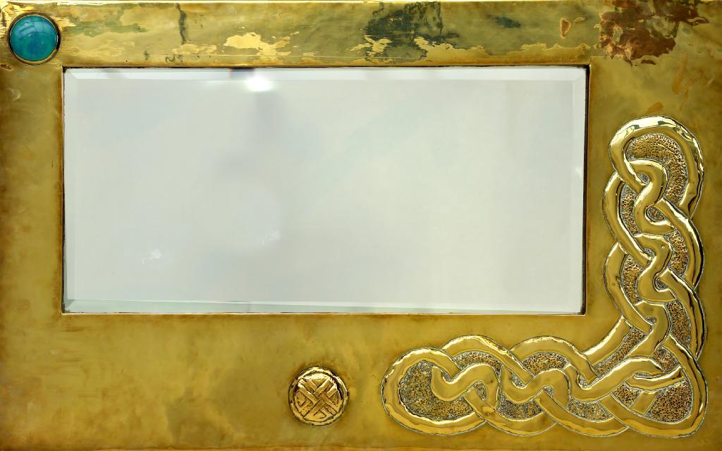 Appraisal: SCOTTISH ARTS CRAFTS BRASS MIRROR the rectangular off-centre mirror-plate within