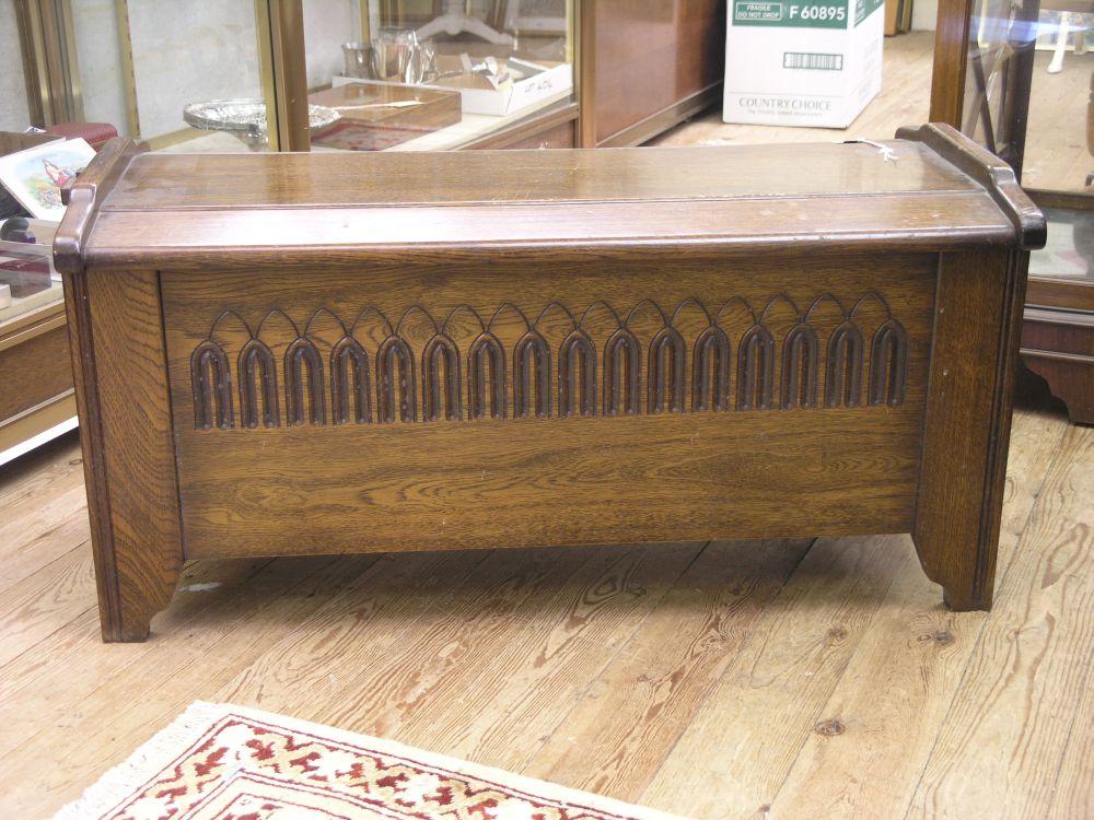 Appraisal: A solid oak coffer the front with gouged ornament ft