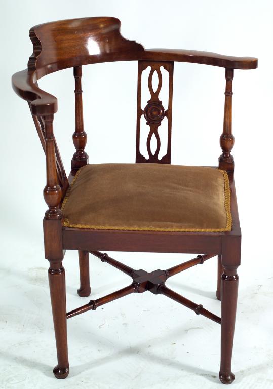 Appraisal: GEORGE III STYLE MAHOGANY CORNER CHAIR c of characteristic form