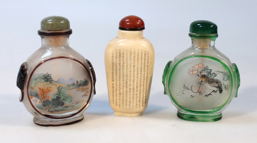 Appraisal: A thC Chinese polished perfume bottle with amber coloured stopper