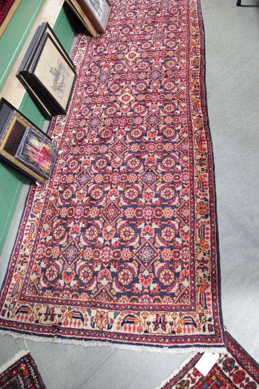 Appraisal: ORIENTAL STYLE RUNNER Midnight blue ground with triple border and