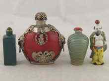 Appraisal: Four ceramic Chinese snuff bottles including one as a Chinaman