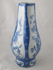 Appraisal: A tall blue and white vase of curve rhomboid section