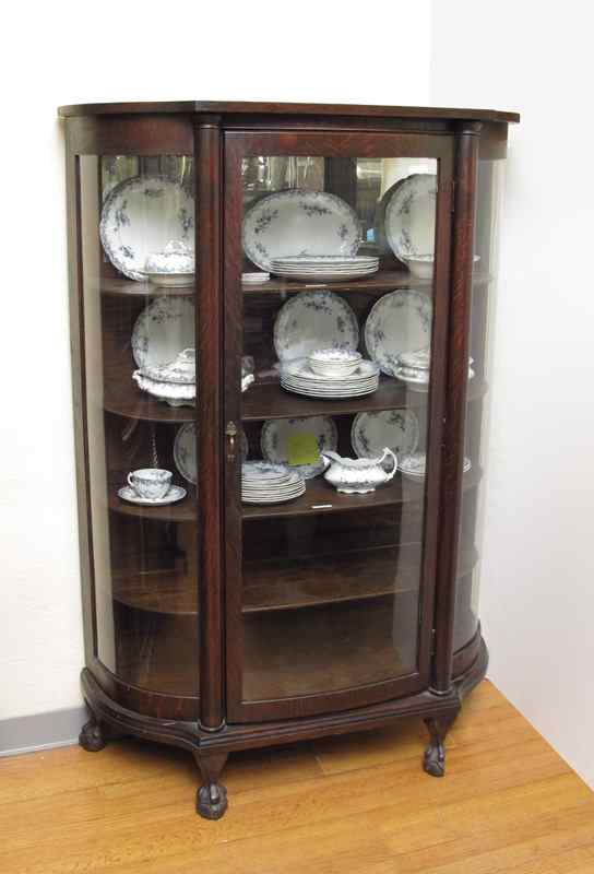 Appraisal: LARKIN TIGER OAK TRIPLE BOWFRONT CHINA CURIO CABINET Oak case