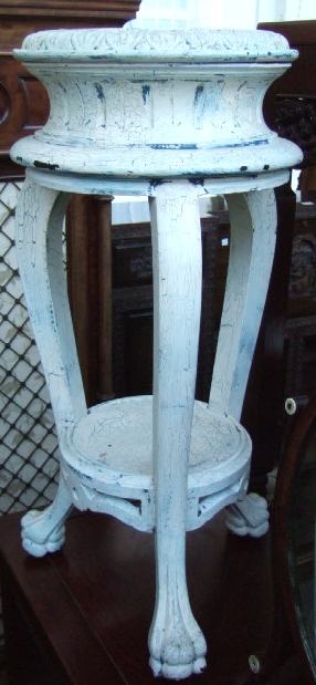 Appraisal: A white painted two tier jardiniere stand raised on shaped