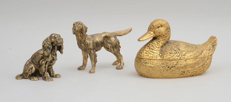 Appraisal: GUCCI GILT-METAL DUCK-FORM TUREEN AND COVER A GUCCI GILT-METAL SETTER