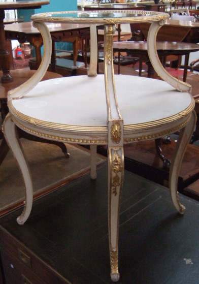 Appraisal: A th century French cream and parcel gilt graduated circular