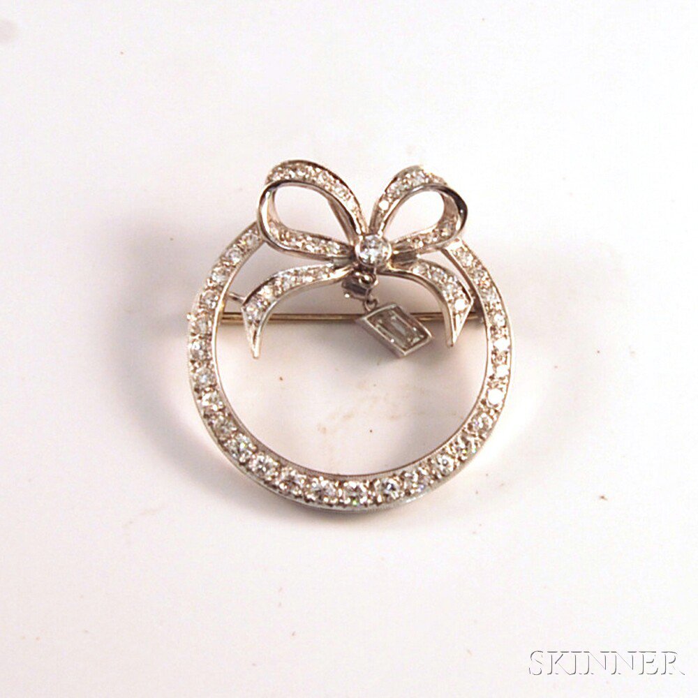 Appraisal: Platinum and Diamond Pendant Brooch the circle pin with ribbon