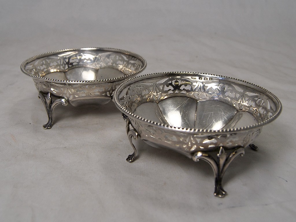 Appraisal: Pair of pierced silver bon bon dishes on three feet