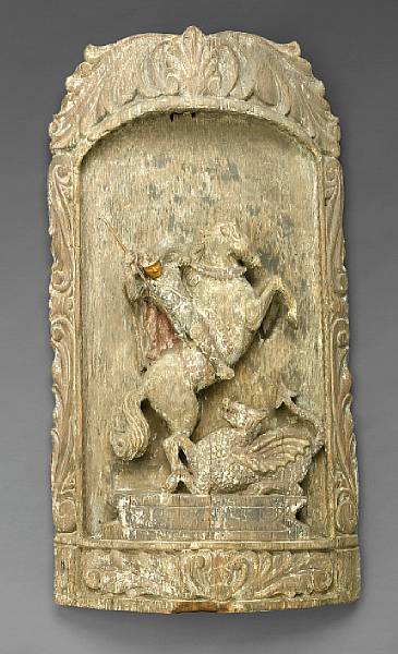 Appraisal: A Northern European carved oak panel depicting St George and