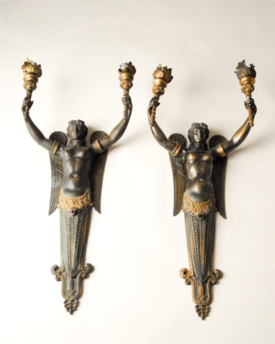 Appraisal: A Pair of Art Deco Bronze Sconces winged angels with