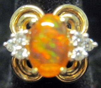 Appraisal: karat yellow gold diamond and opal ring Cabochon opal flanked