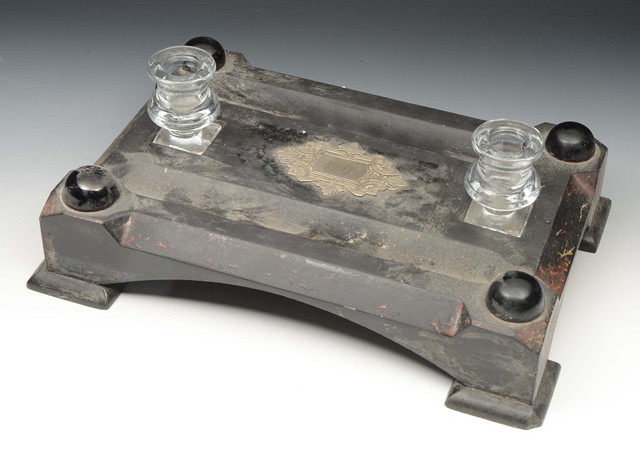 Appraisal: A REGENCY BLACK SLATE PEN TRAY of stylised form on