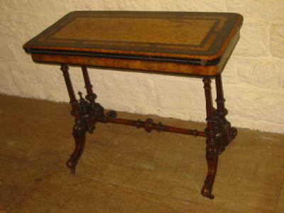 Appraisal: A VICTORIAN WALNUT FOLDING CARD TABLE the moulded edged rounded